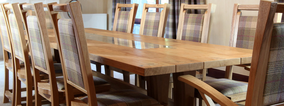 Dining table in oak with refectory style legs