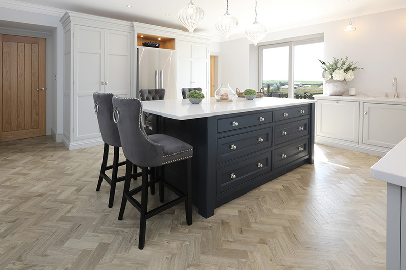 Barnahill kitchen island with stools