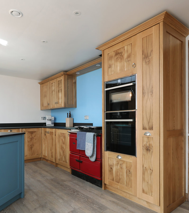 Oak kitchen, red aga stove and integrated appliances